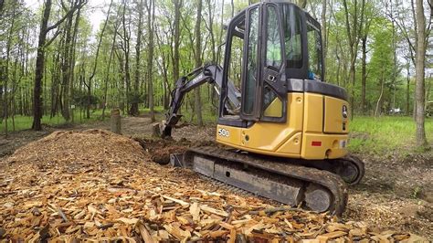 digging stumps with mini excavator|remove stumps with mini excavator.